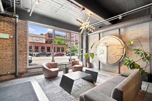 As you come in from the street, the welcoming lobby with the original boiler door as decor is to your left. Nordic Plaza is right across the street.