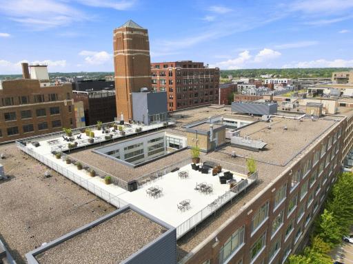 Top floor amenities include fire pits, grills, and ample seating.