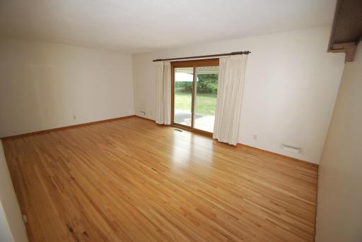 Patio door in living room leads to a beautiful patio