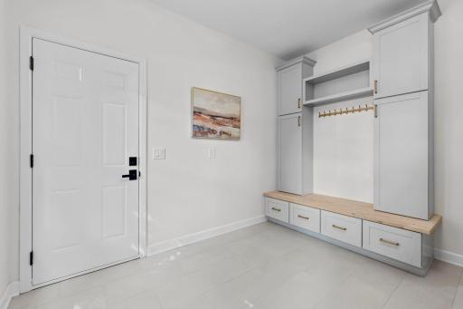 Welcoming mudroom entry with built-in bench, cubbies, and a clean, organized layout perfect for busy households.
