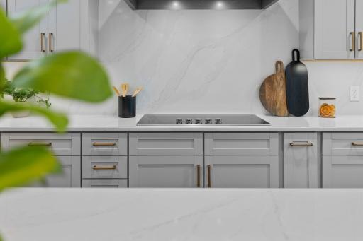 Beautifully detailed kitchen with designer hardware and thoughtful storage built into every corner.