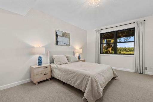 Lower level 5th Bedroom, a comfortable and private retreat with lake views, perfect for guests or extended family.