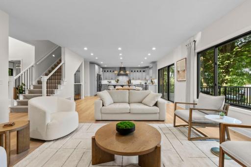 Open and airy living space with a neutral palette, oversized windows, and a layout that flows effortlessly throughout the main level.