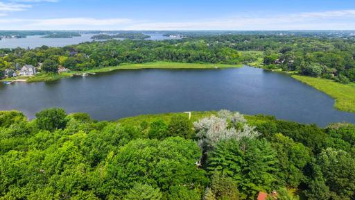 Stunning aerial view of Lake Virginia showcasing the expansive open water, lush shoreline, and the incredible natural setting surrounding this property.