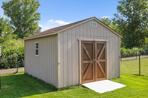 Bonus! Large shed with ramp for your lawn care and outdoor items!