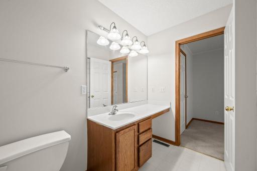 Ensuite full bath features a long vanity with plenty of counter space and storage.