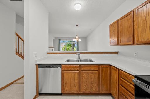 Open kitchen design keeps you connected to the dining and living spaces, with plenty of cabinetry and counter space for meal prep