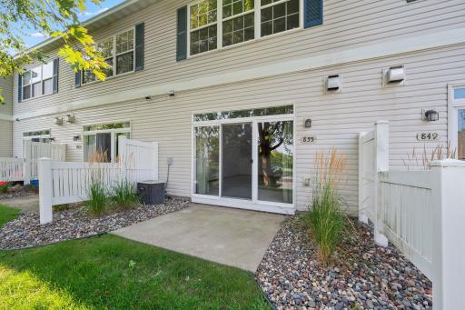 Step outside through the living room to a private patio—an easy spot for grilling, outdoor dining, or simply relaxing