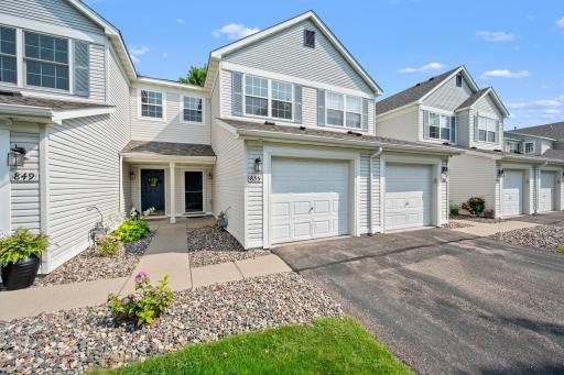 A welcoming entrance and attached garage add everyday convenience to the home