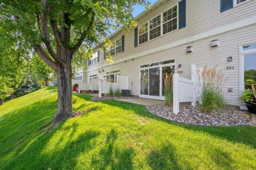 Mature trees and green space create a pleasant backyard setting