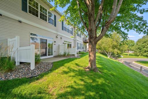 Enjoy the ease of low-maintenance townhome living with mature trees, green space, and no weekend lawn work to worry about