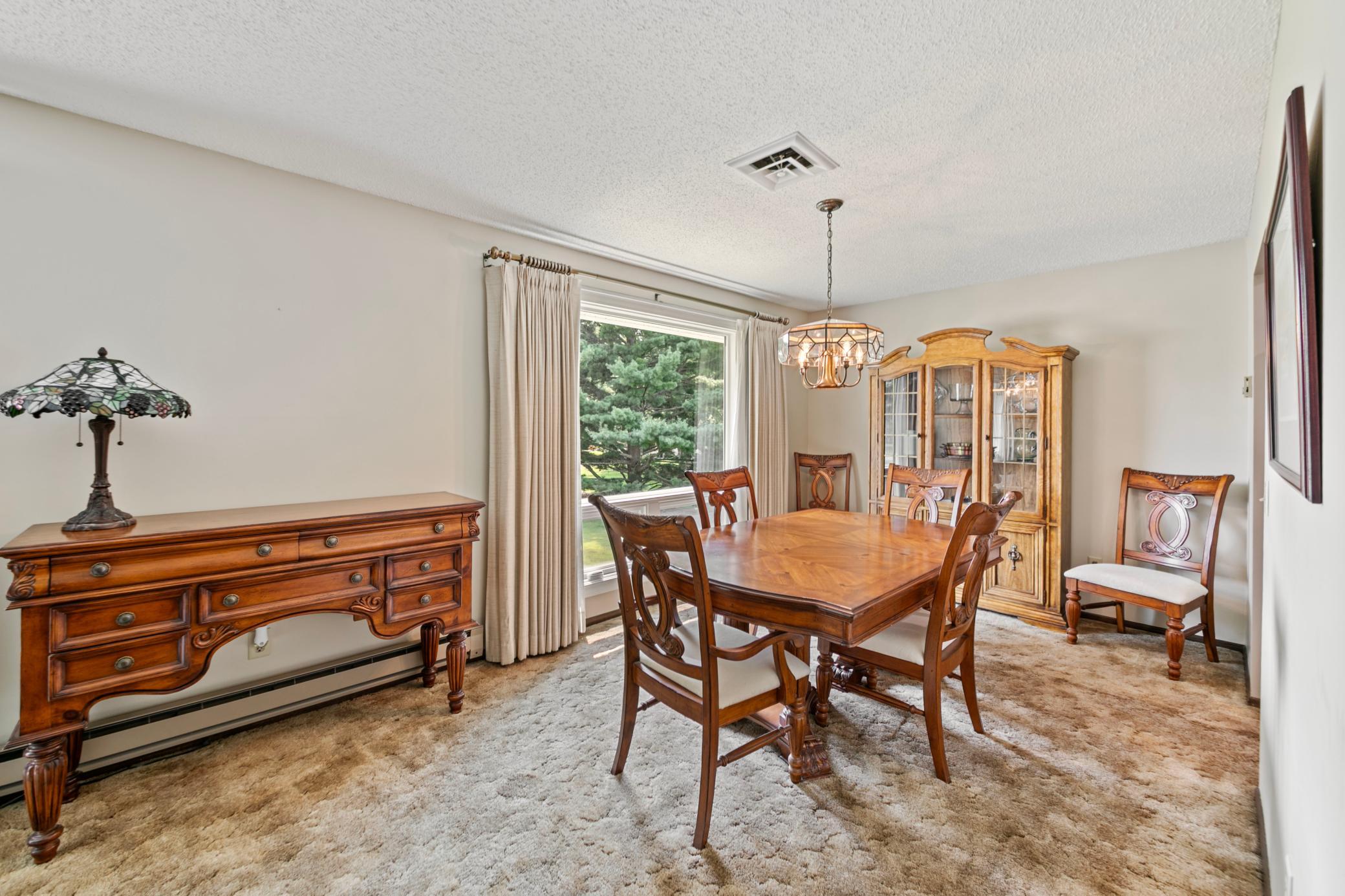 Dining room off the kitchen with an abundance of natural light with these newer windows