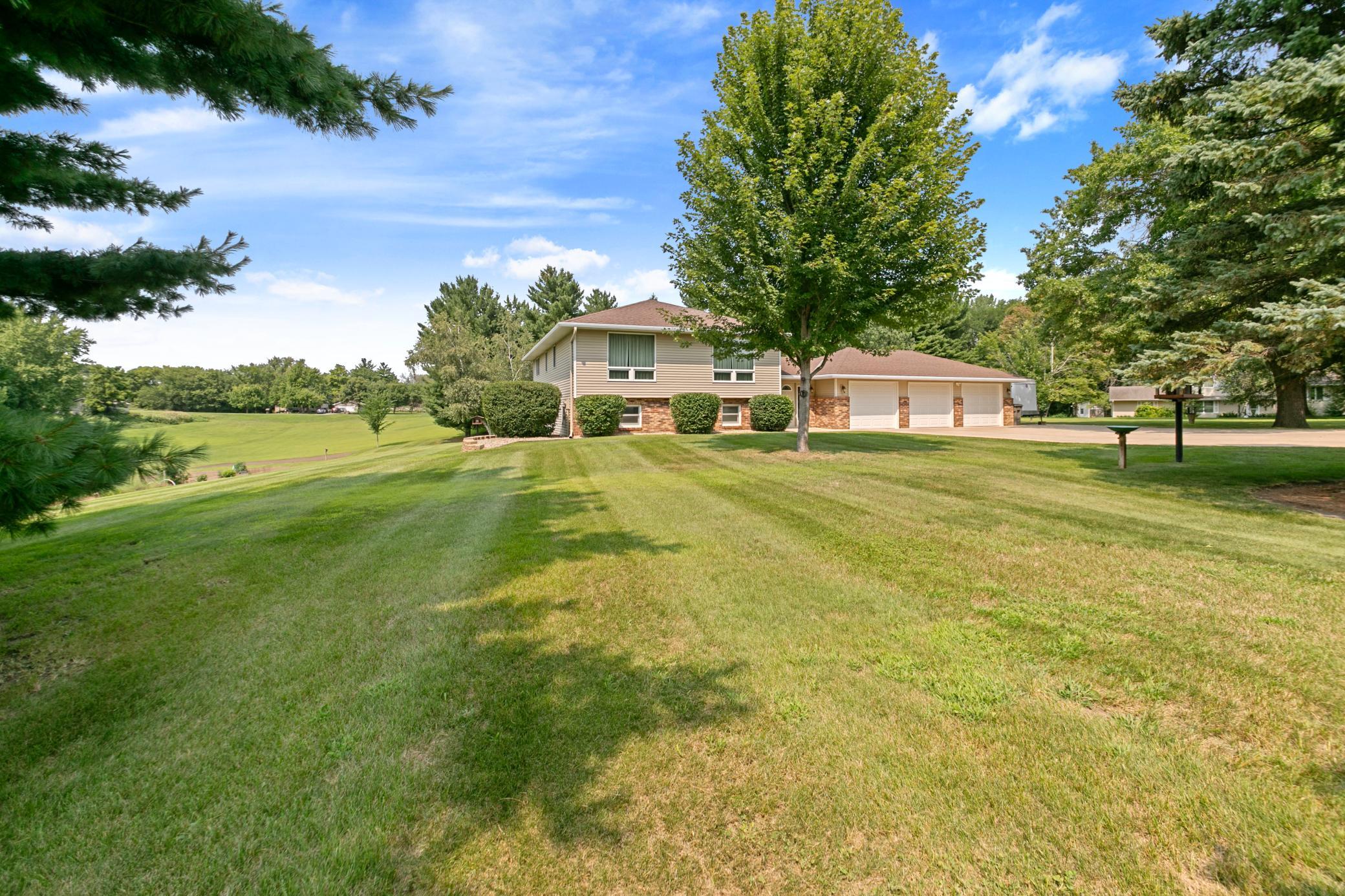 Wonderful front yard, concrete driveway and steel siding