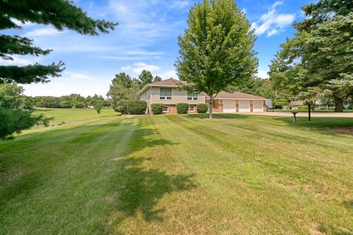 Wonderful front yard, concrete driveway and steel siding