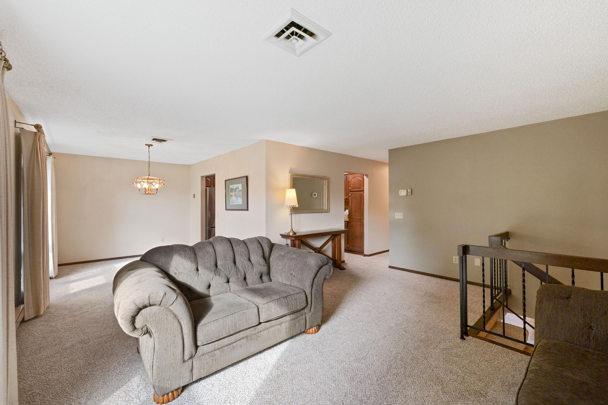 Upper level living room with new carpet