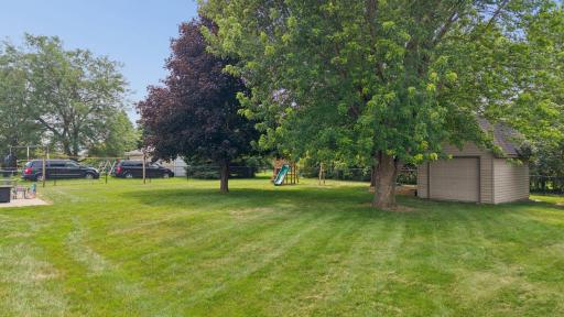 Mature trees & storage shed in yard