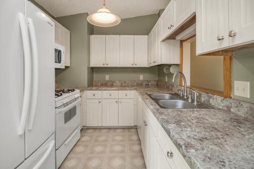 Newer appliances and all clean as a whistle! Highly functional kitchen with pass thru to living area and great storage.