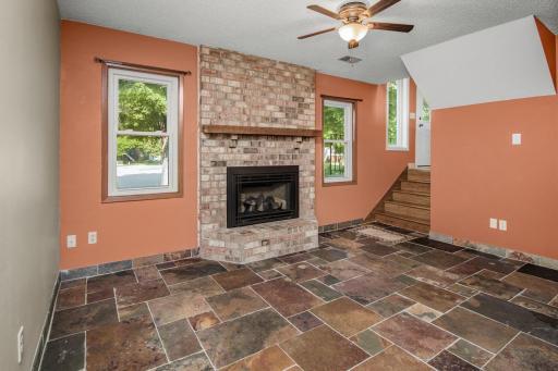 Cozy family room with newer gas fireplace and lookout windows.