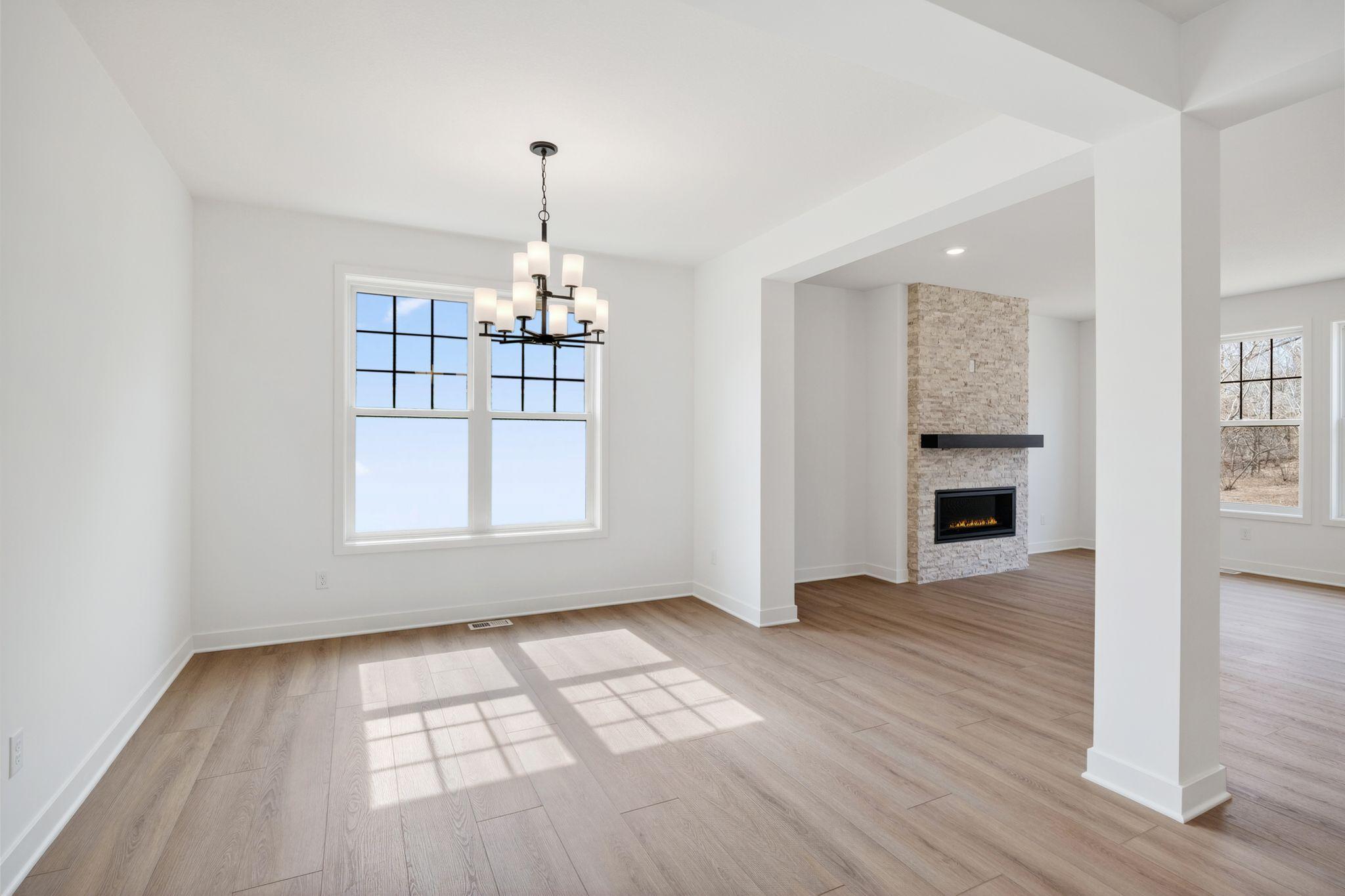 (Photo of a similar home, actual finishes may vary) Tucked conveniently between the Great Room and the office is a formal dining room, ideal for cozy meals with family and important occasions with friends.