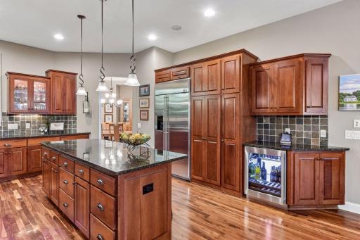 Well-appointed kitchen with abundant cabinetry and new beverage refrigerator.