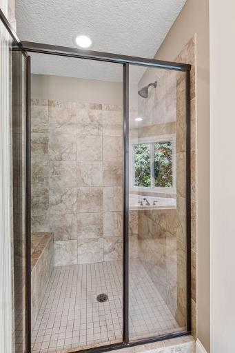 Separate tiled shower completes the well-appointed primary bath.