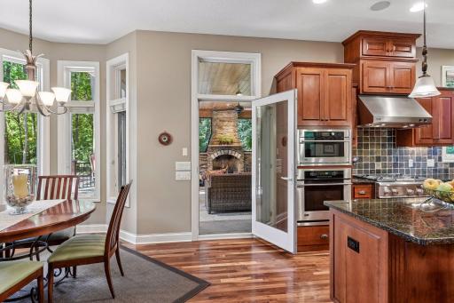 Easy flow from the kitchen to the inviting three-season porch.