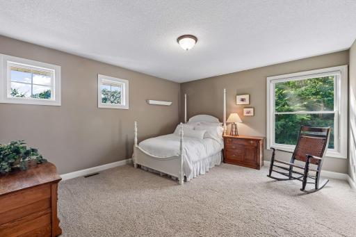 Bright, spacious secondary bedroom offers flexibility for family or guests.