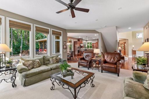 Open, comfortable family room flows easily into the kitchen and dining areas.