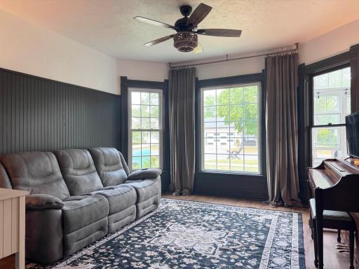 Views of the living room with its marvelous wall of windows.