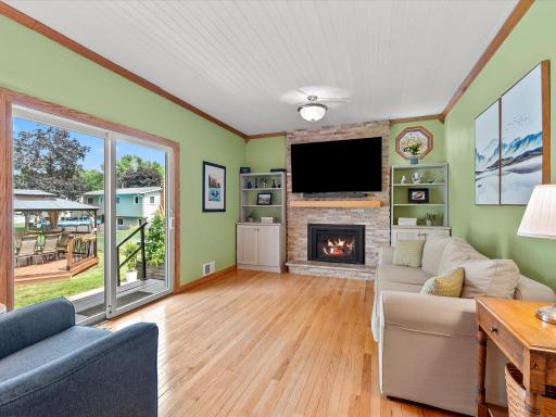 Here is the comfy rear family room with gas fireplace.