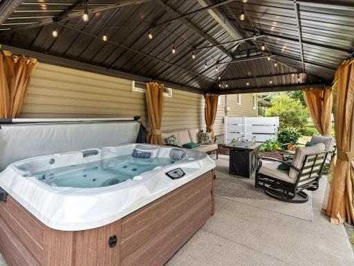 Hang out on the back patio and soak in the hot tub!