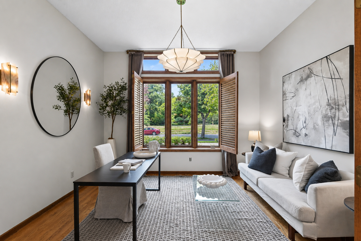 Plantation shutters frame peaceful park views and fill the room with natural light.
