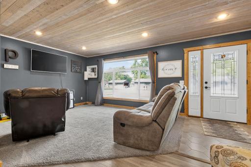 2 living rooms on the main level! Check out the stunning window that floods the room with natural light.