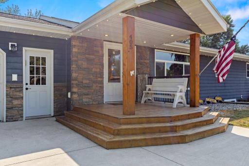 Covered front porch and beautiful spot to welcome guests!
