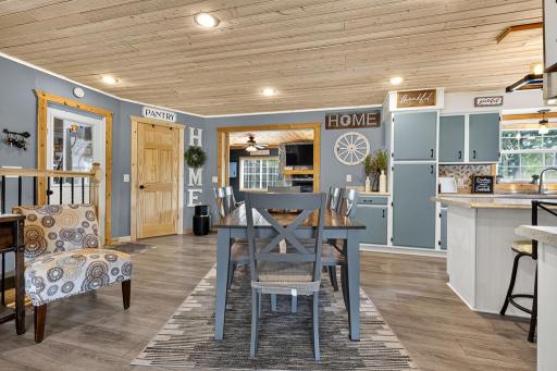 Open concept dining, kitchen, and both living rooms.