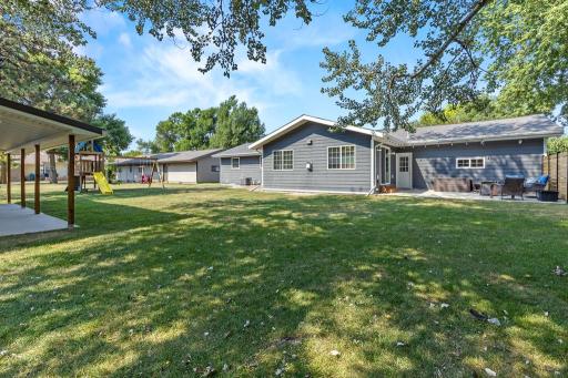 Large backyard with privacy, patio, and a detached garage!