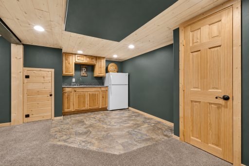 Wet bar in basement! Perfect kitchenette space to entertain!