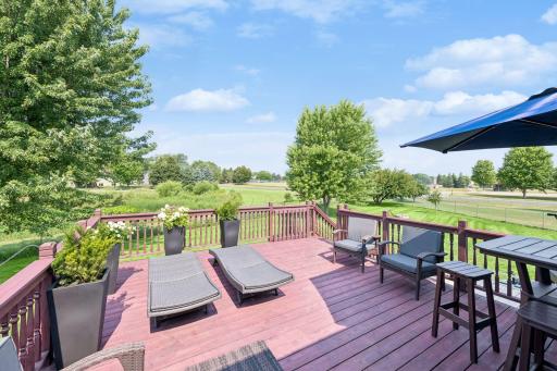 Expansive 20' x 16' deck made for entertaining. Enjoy sunsets from the deck! Feels like acreage with city owned land behind and Heritage Park in the distance.