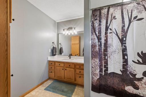 Primary bath updated with new quartz countertops, sink, and fixtures. New lighting too!