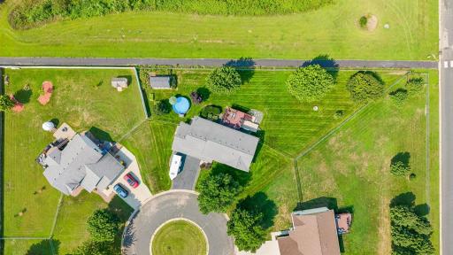 Huge, fully fenced yard. Trail provides kids a place to ride bikes and scooters without worrying about cars.