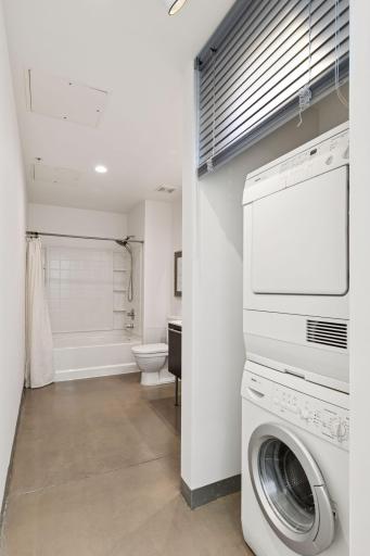 Put down the metal blinds to conceal the laundry units.