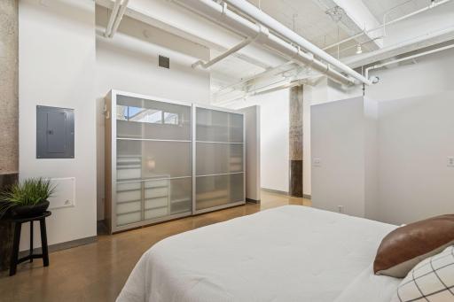 Loft style but with semi-private primary bedroom.