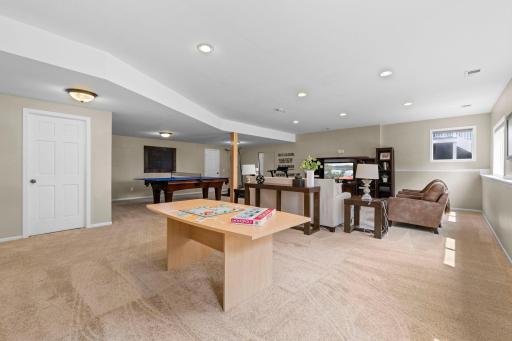 Spacious family room with a bar rough in.