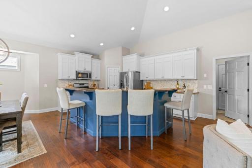 Open flow from the living room into the kitchen and dining area.