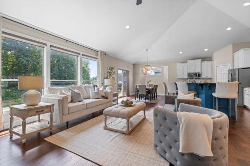 Large picture windows overlooking the backyard.