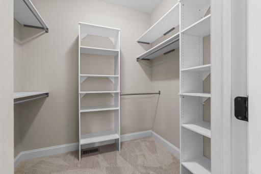Spacious walk-in closet with built-in organization in the primary suite.