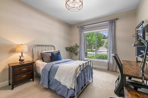 Second bedroom on the main level overlooking the front yard.