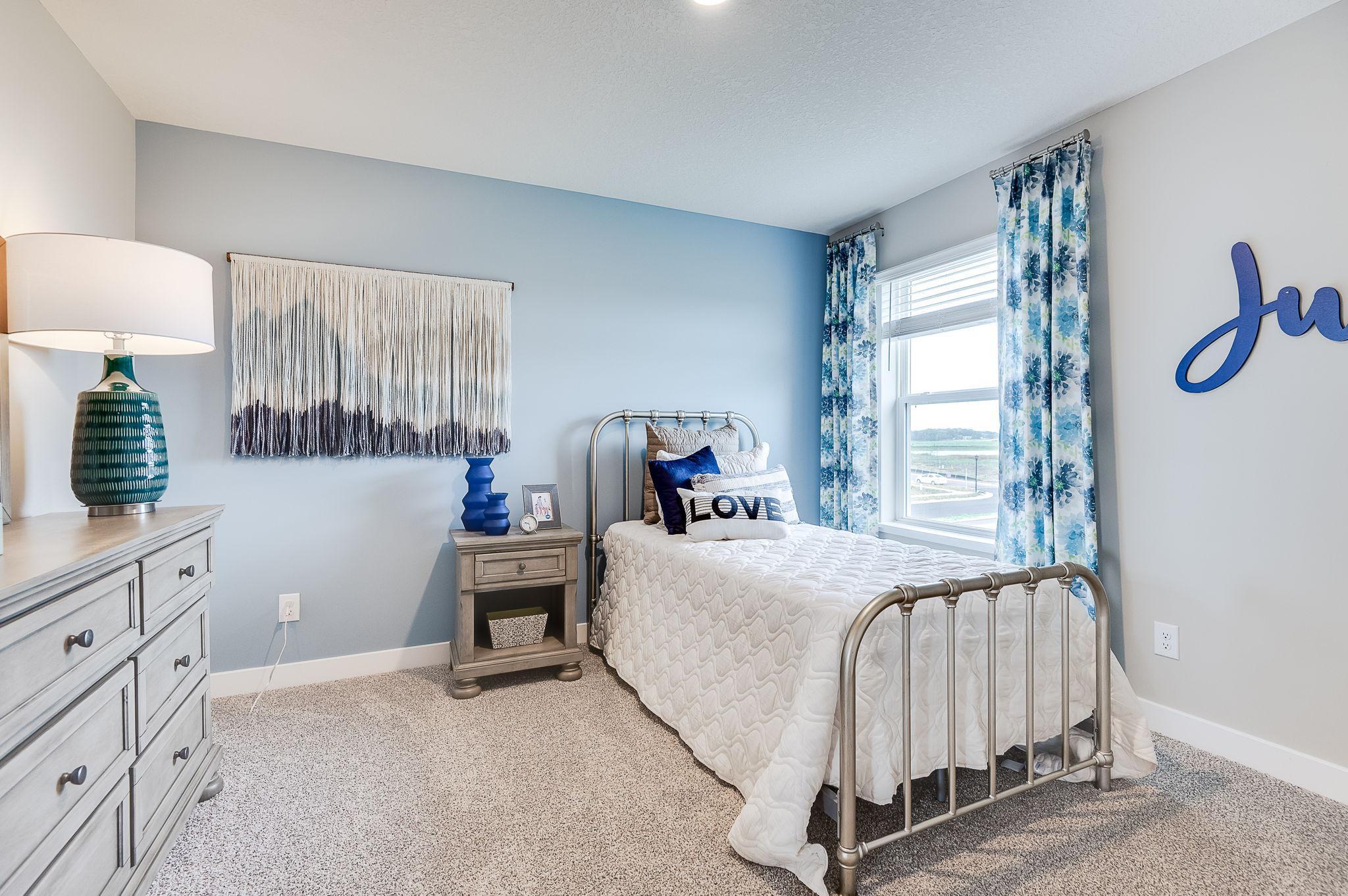 Bedroom 4 of 4 located upstairs. Model picture shown. Colors and finishes may vary.