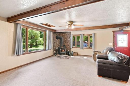 Spacious living room with cozy wood burning fireplace