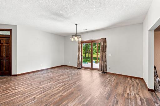 Spacious dining room w/ walk out access to the backyard patio